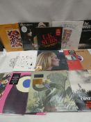 Box containing LP and 45 records to include Adele, Kings of Leon, Death Row and others