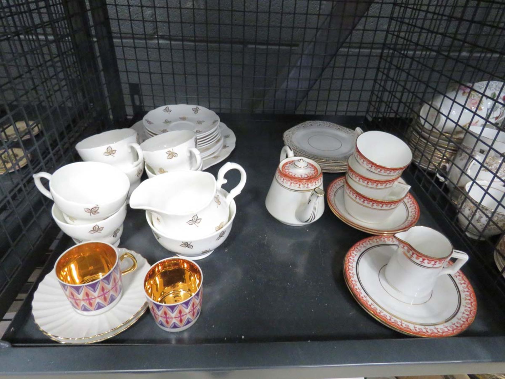 Cage containing Duchess floral patterned crockery plus Shelley cups and saucers