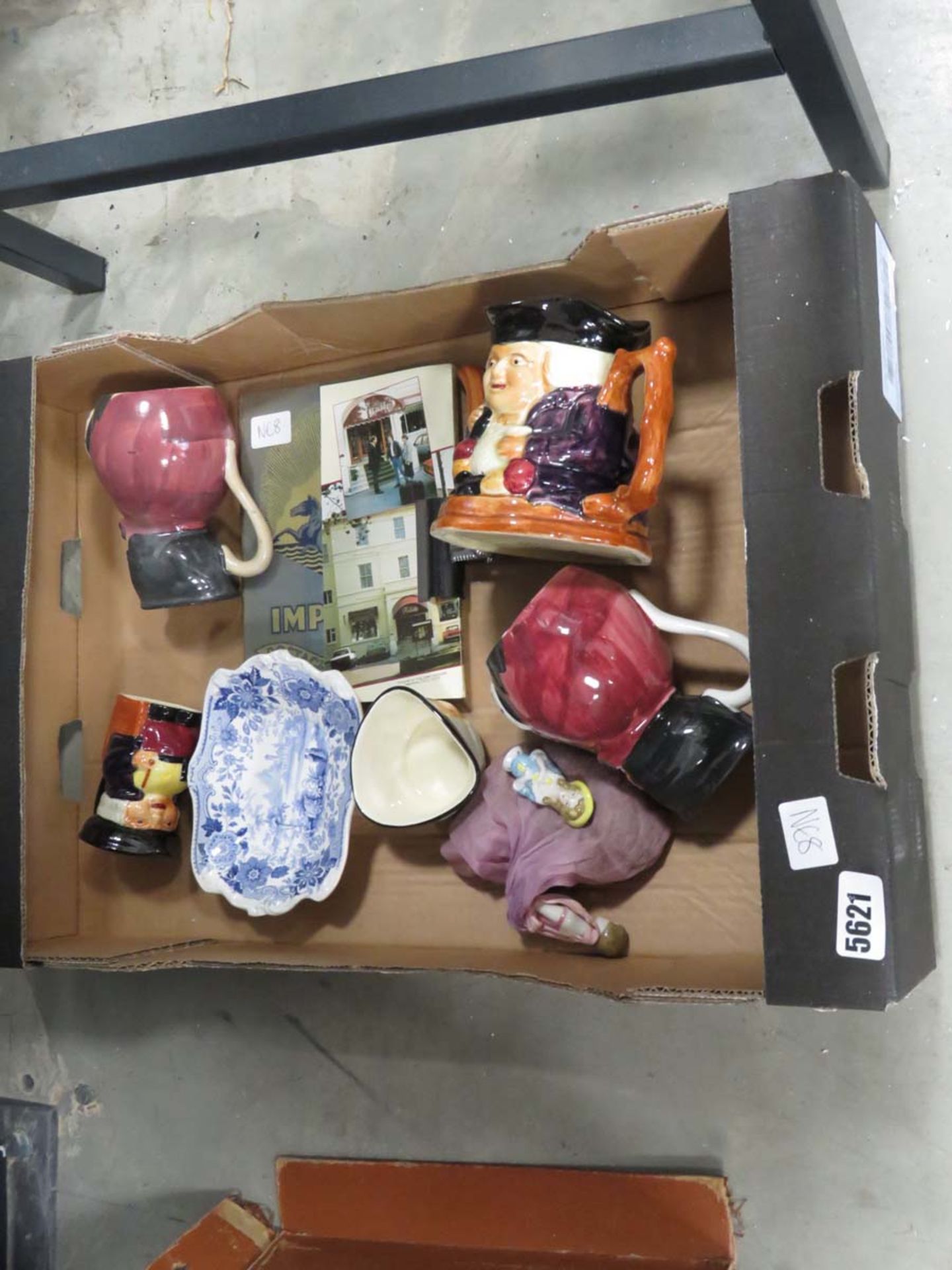 Box containing Toby jugs and crockery