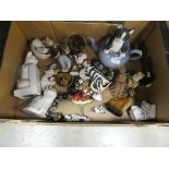 Box containing ornamental cat figures