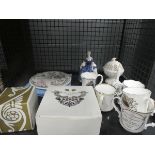 Cage containing commemorative mugs, collectors plates and a Doulton lady