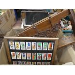 Box containing cigarette cards, flag picture, tabletop swing mirror, and coat rack