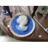 Pair of blue and white glazed wall plaques - boy and girl