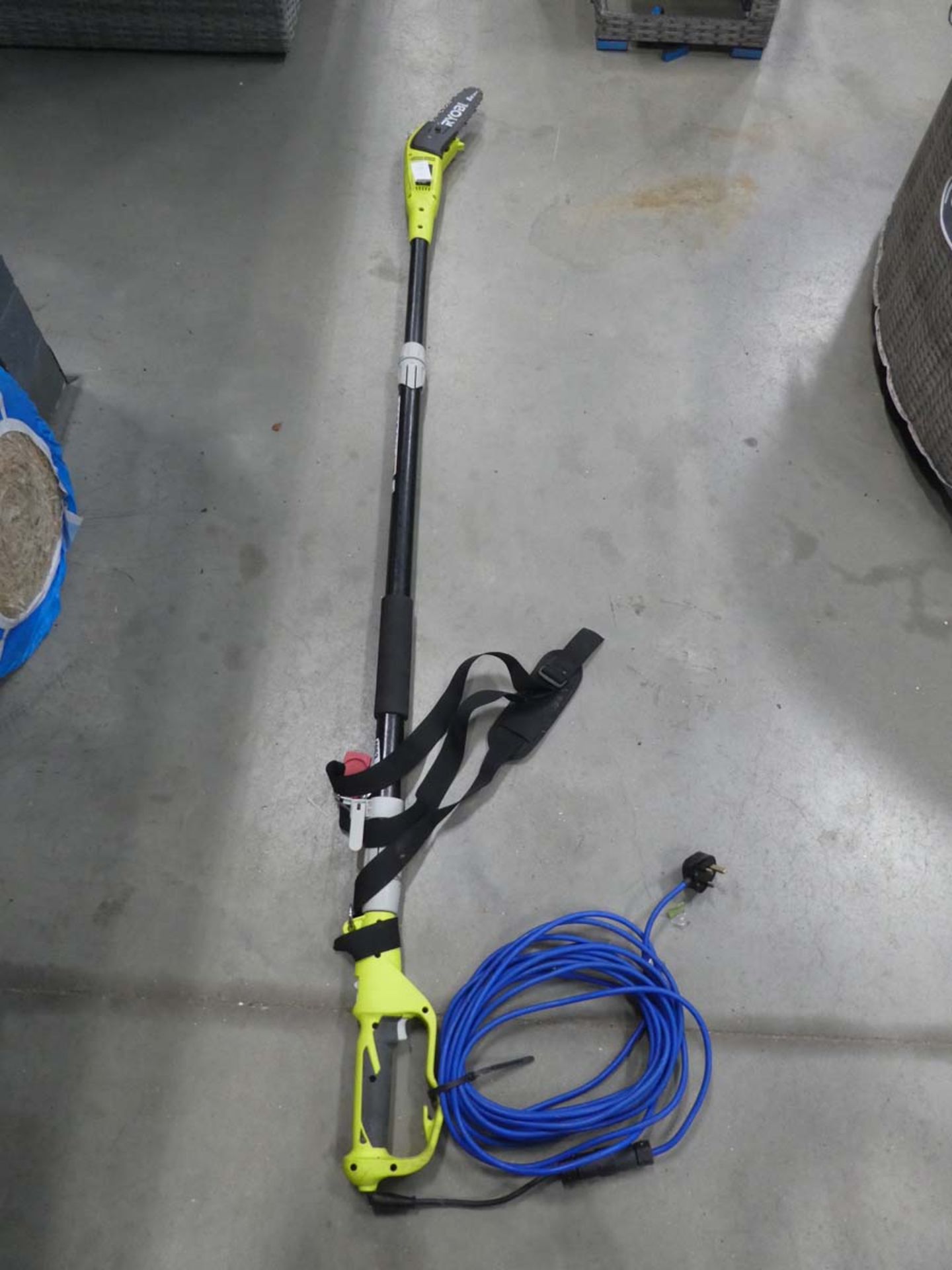 Green electric long reach hedge cutter