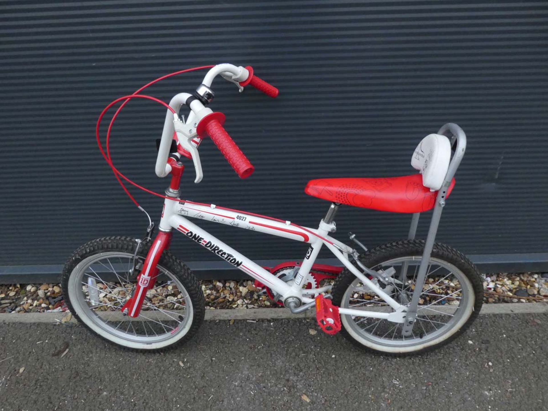 One Direction white and red child's bike with tall handle bars