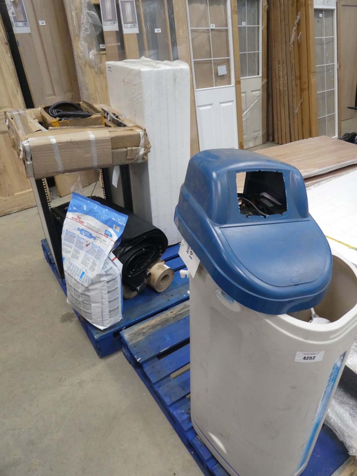 2 pallets containing water softener, dog food, step strips, comms cabinet shell, polystyrene