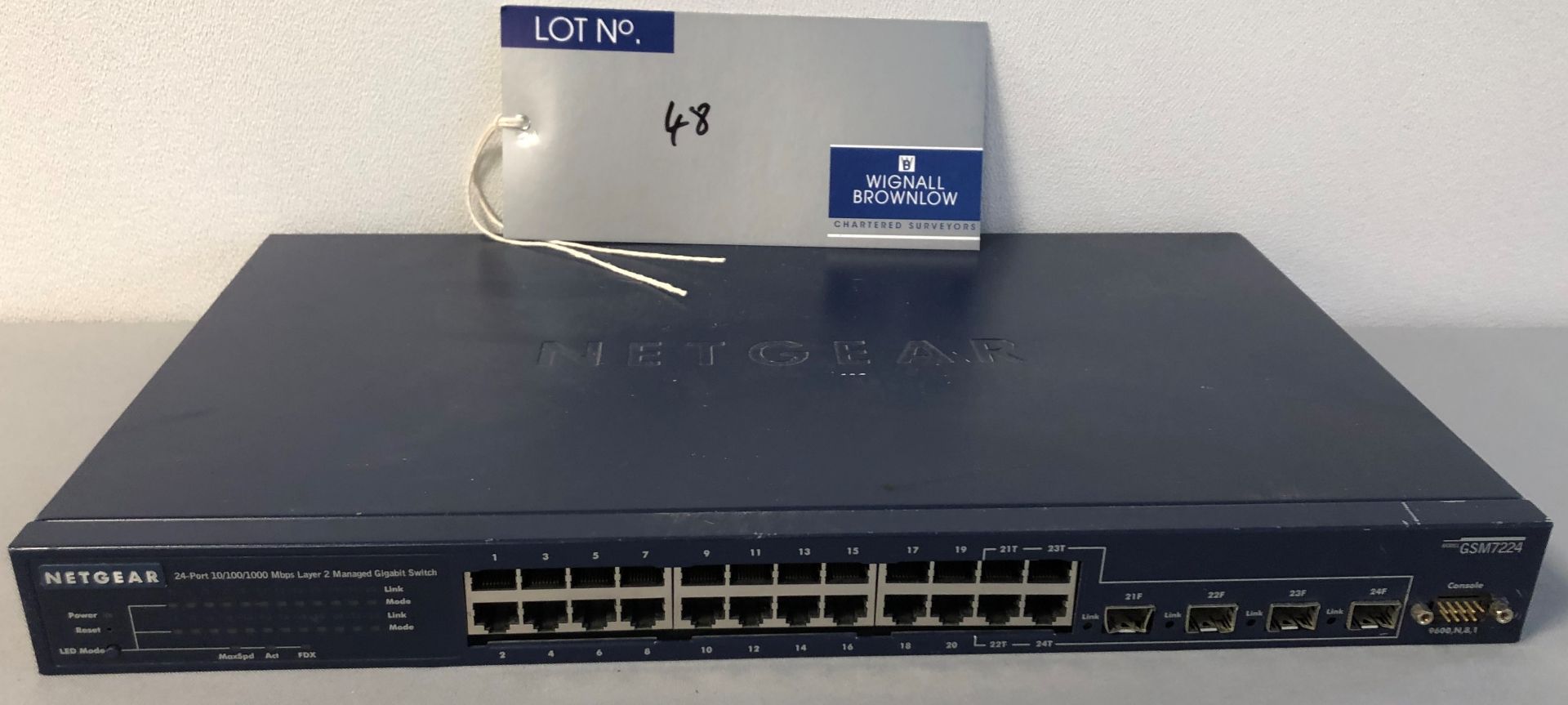 A Netgear GSM 7224 24-Port 10/100/1000 Mbps Layer 2 Managed Gigabit Switch (powers up).