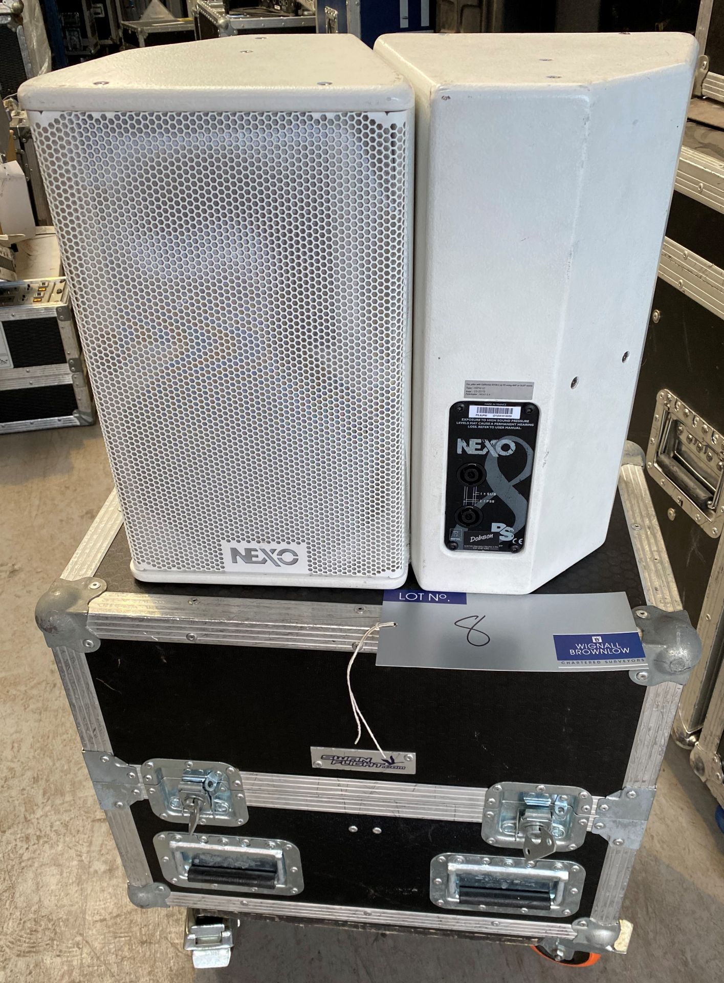 A Pair of NEXO PS8UPW Monitor Speakers in white with pole mount and mobile flight case (in working