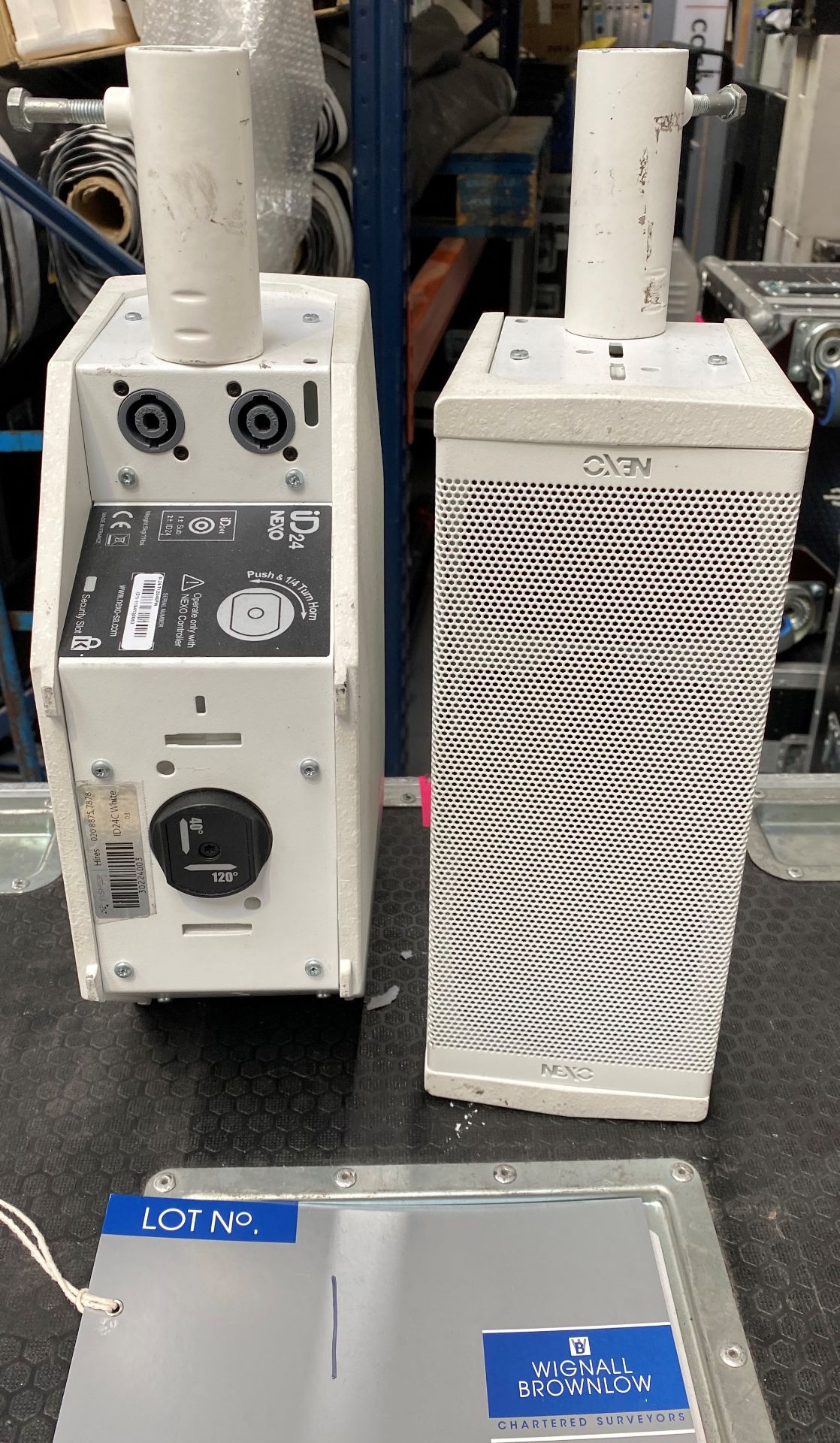 A Pair of NEXO ID24 Speakers in white fitted with pole mount and mobile flight case (in working - Image 2 of 4