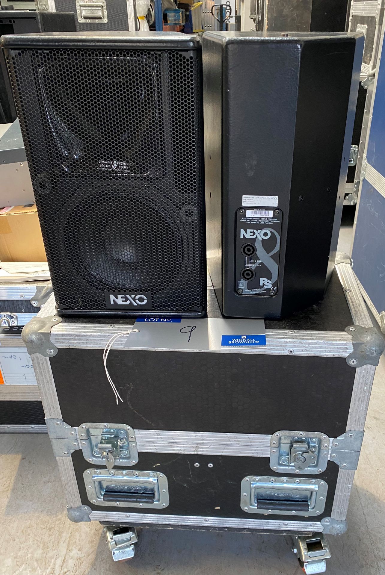 A Pair of NEXO PS8U Monitor Speakers in black with pole mount and mobile flight case (in working