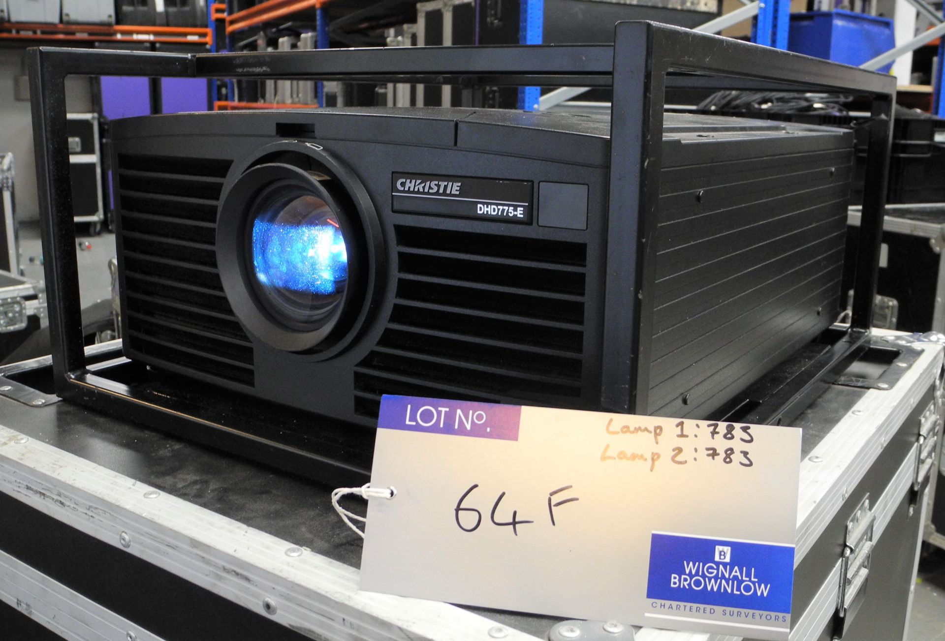 A Christie DHD775-E 7k HD DLP Projector with flying frame, 4 x spare lamp, warp cards installed,