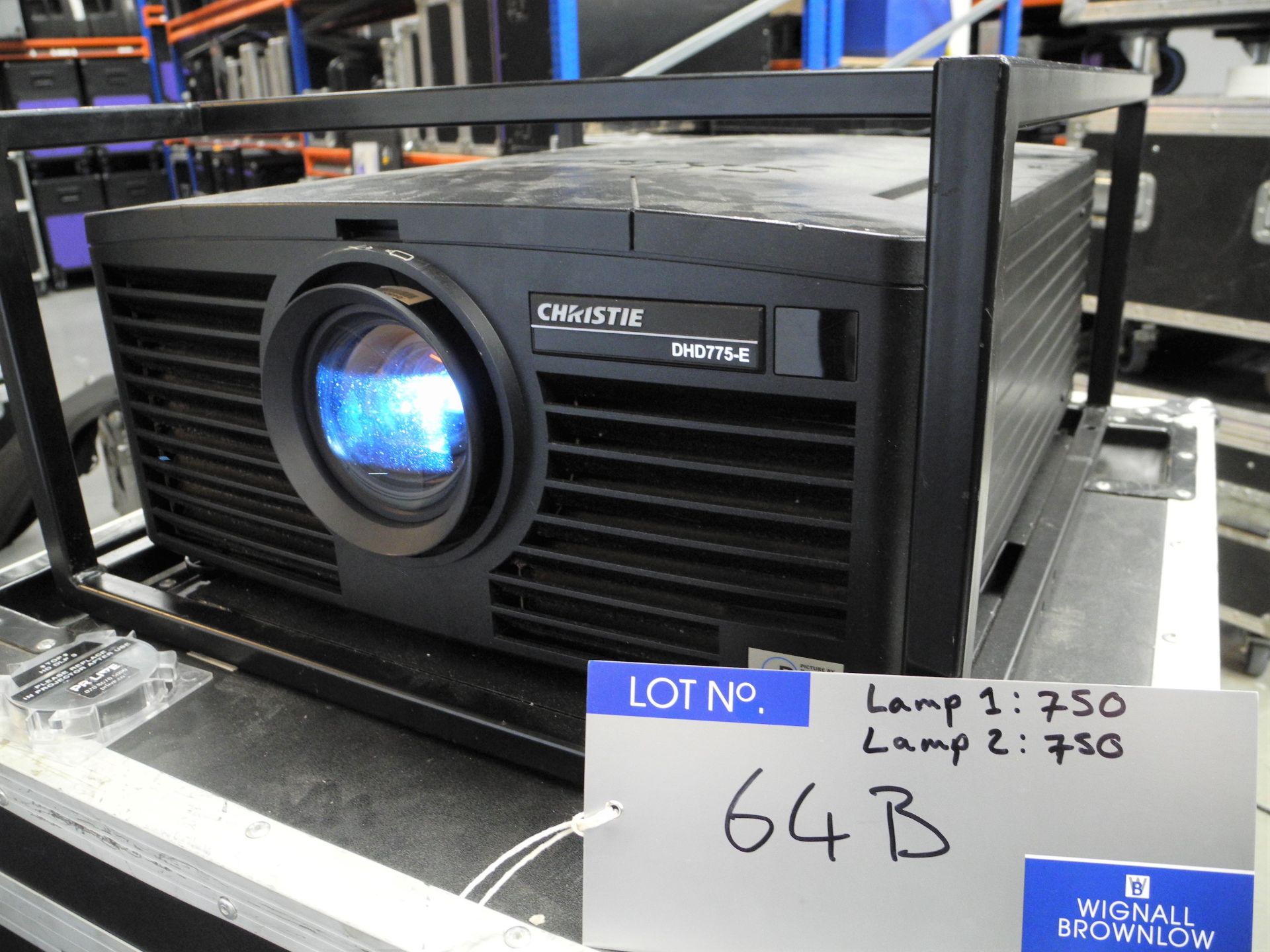 A Christie DHD775-E 7k HD DLP Projector with flying frame, 4 x spare lamp, warp cards installed,