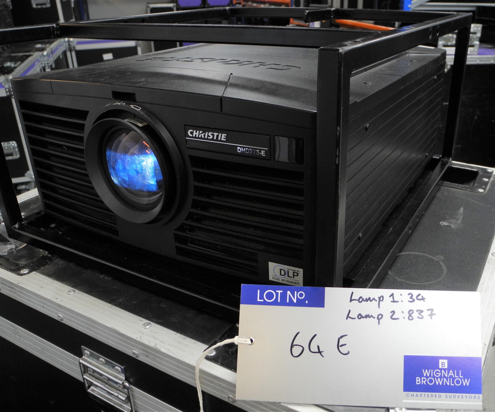 A Christie DHD775-E 7k HD DLP Projector with flying frame, 4 x spare lamp, warp cards installed,