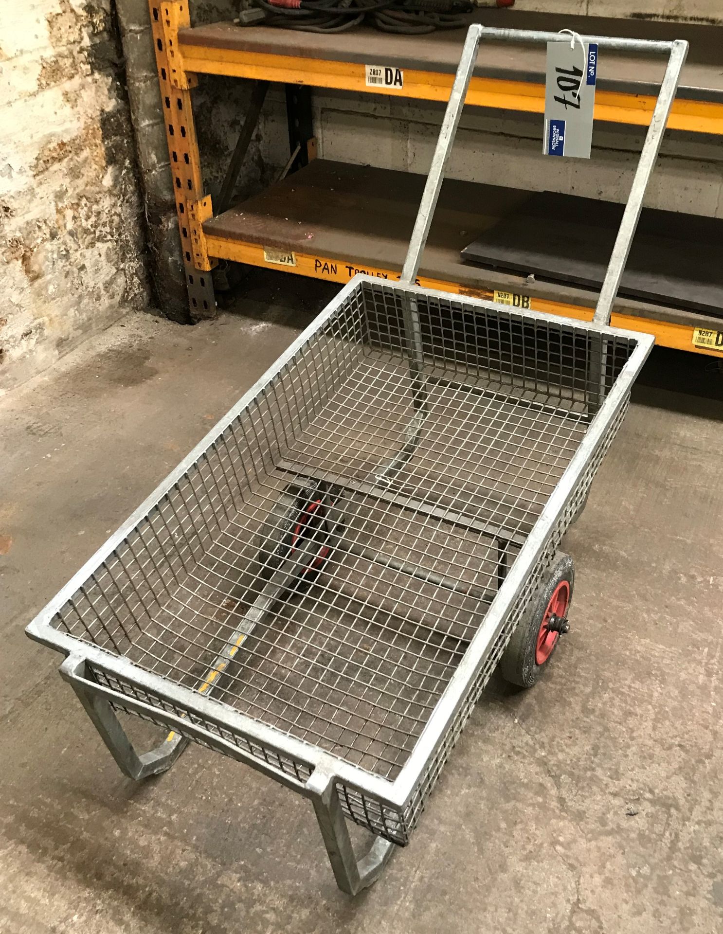 A Single Axle Steel Framed Mesh Trolley, 38in lg x 24in w x 8in dp.