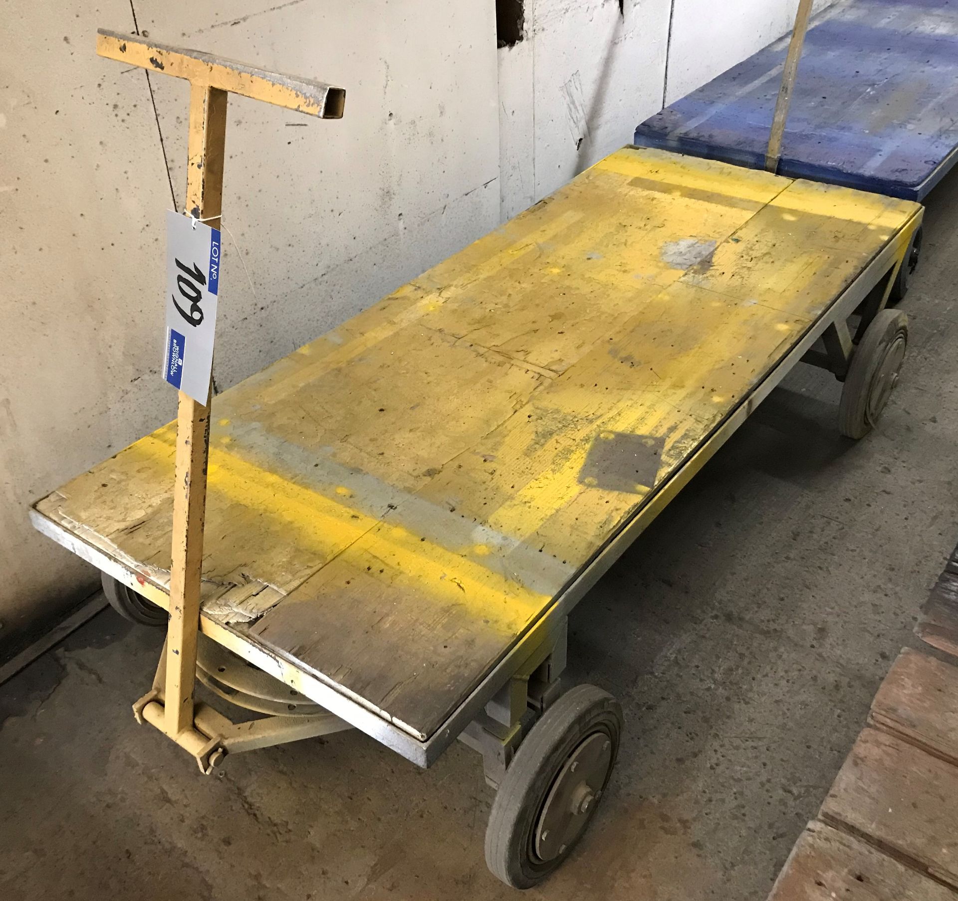 A Twin Axle Steerable Timber Boarded Trolley, 75in lg x 31in w, 18in to floor.