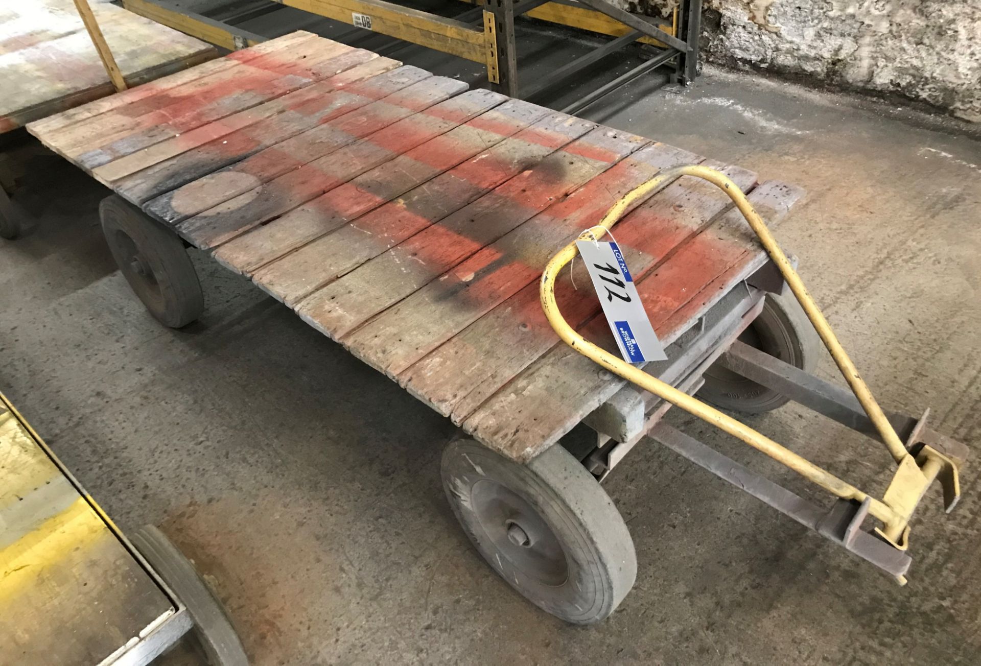 A Twin Axle Steerable Timber Boarded Trolley, 68in lg x 36in w, 22in to floor.