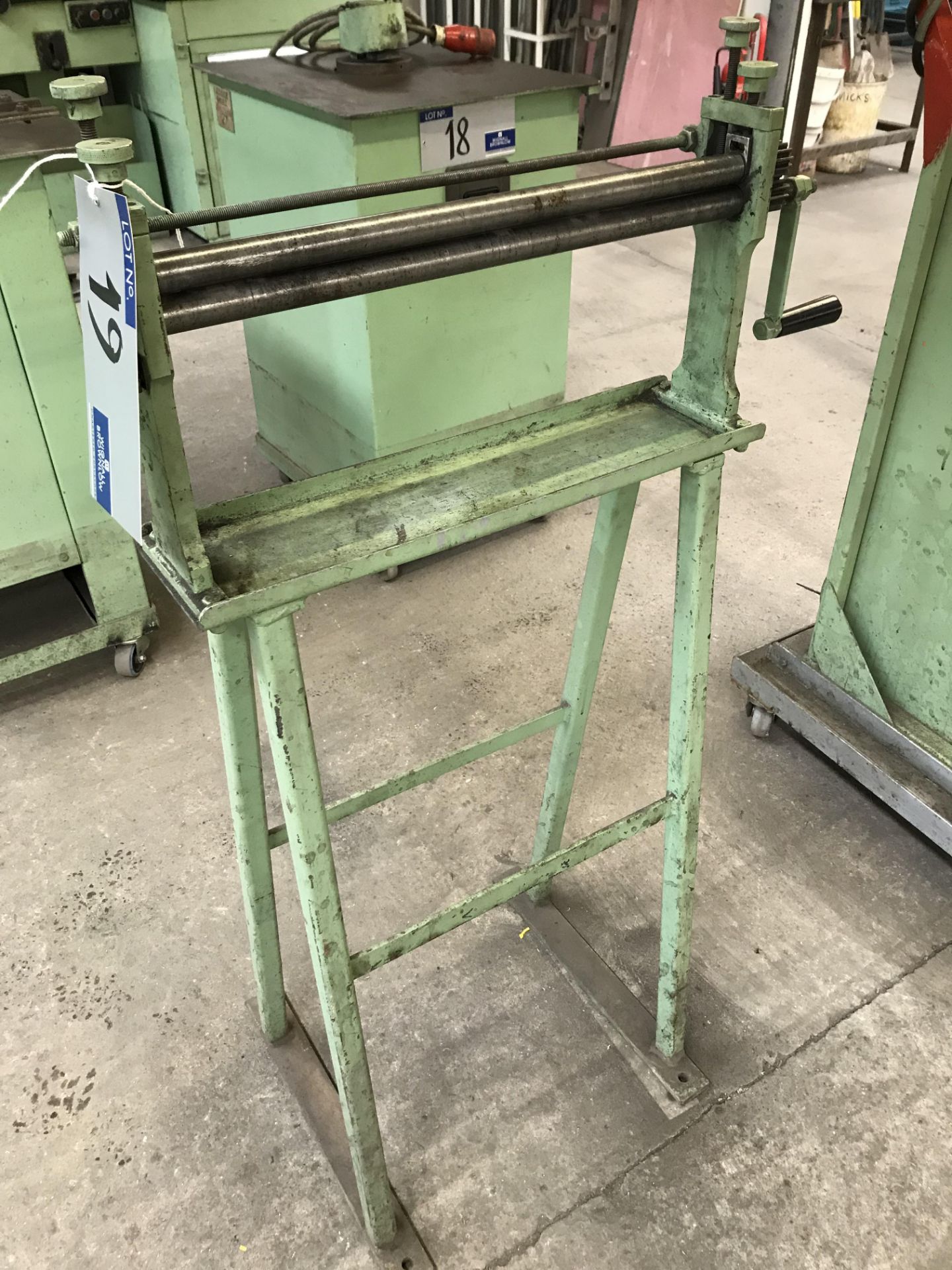 A Set of Manual Triple Bending Rolls, 20in x 1in on steel stand.