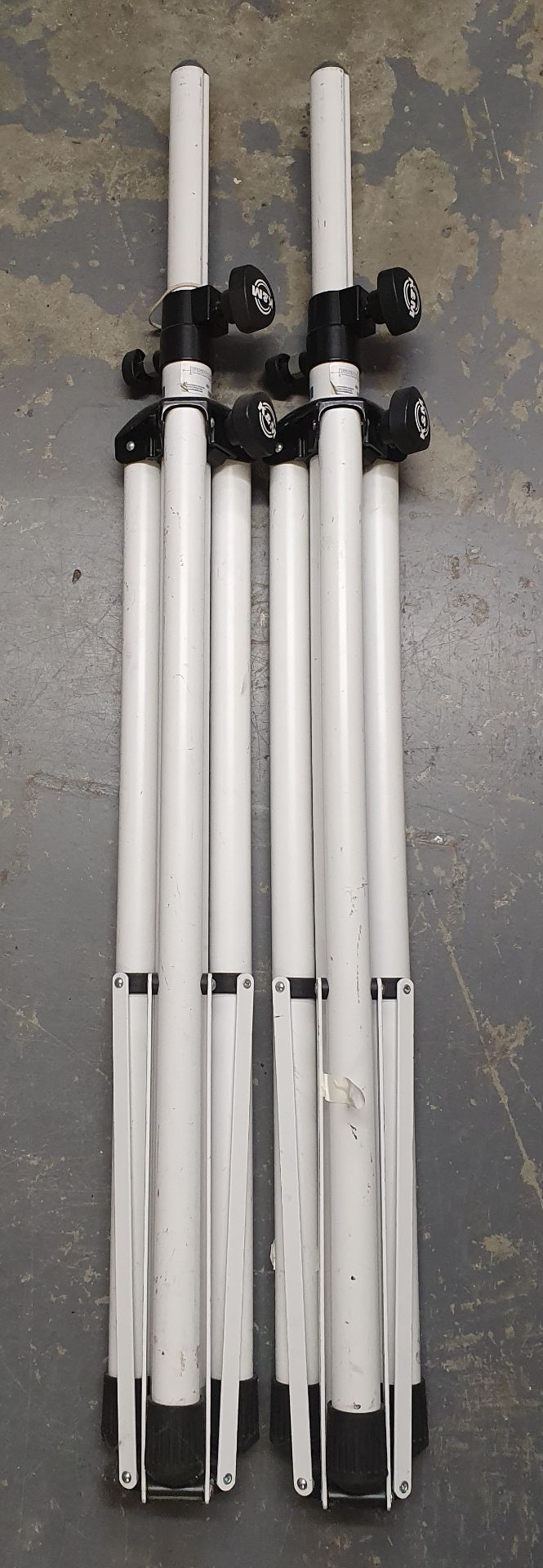 A pair of K+M White Tripod Speaker Stands, no bag
