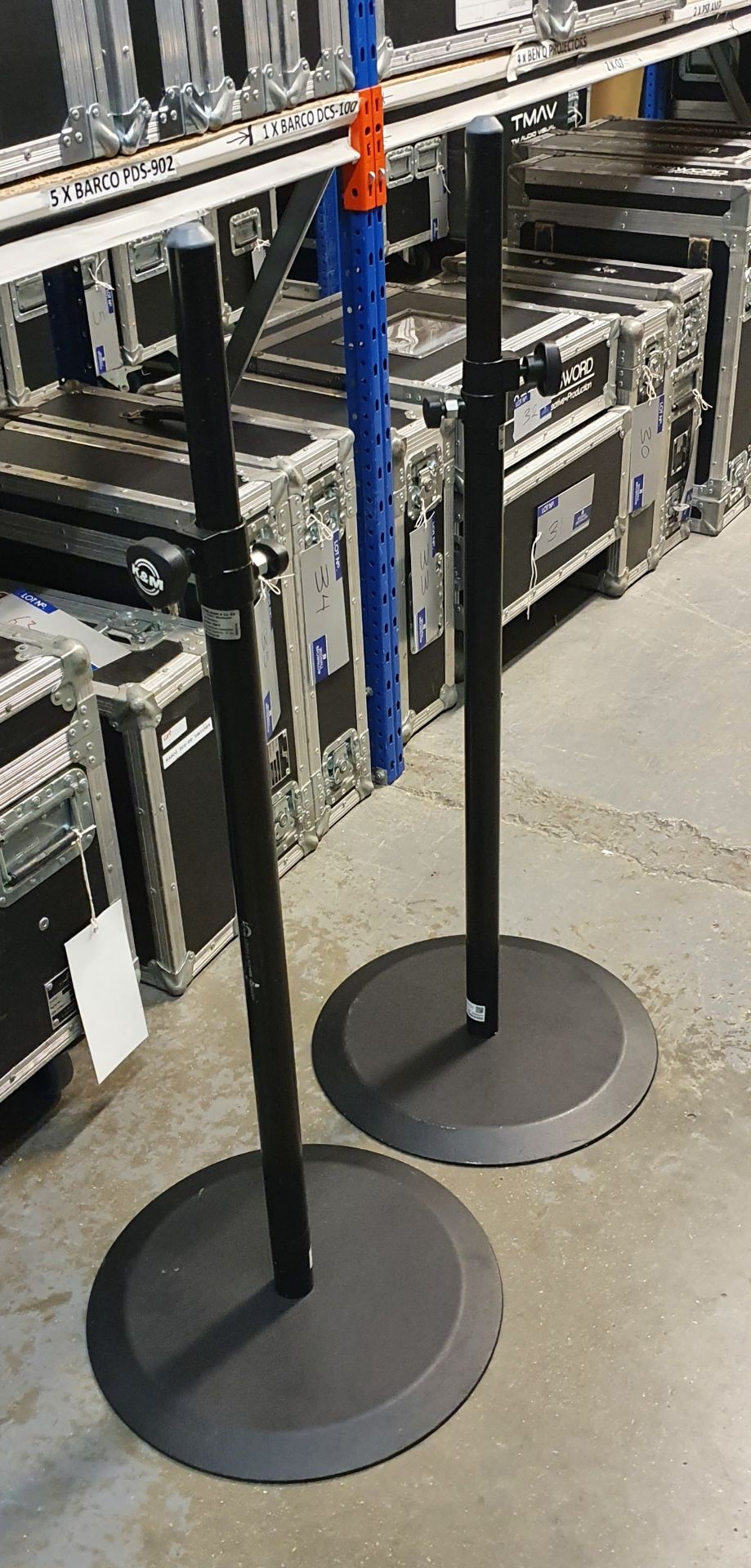 A Pair of K+M Black Speaker Round Base Stands comprising: 2 poles and 2 bases with carry bags.