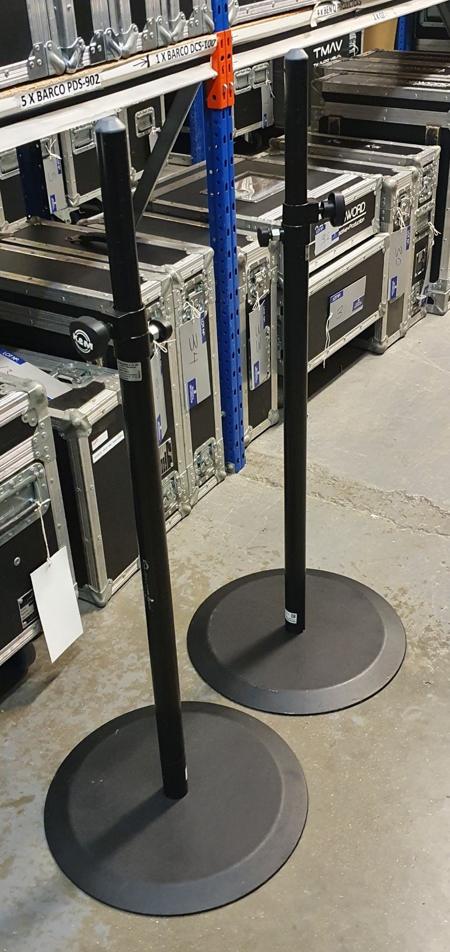 A Pair of K+M Black Speaker Round Base Stands comprising: 2 poles and 2 bases with carry bags.