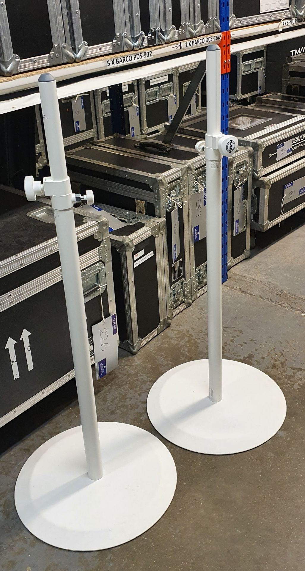 A Pair of K+M White Speaker Round Base Stands comprising: 2 poles and 2 bases with carry bags.