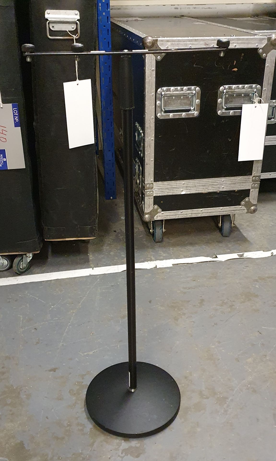 A Black Microphone Stand comprising: base, pole, t-bar with carry bag.