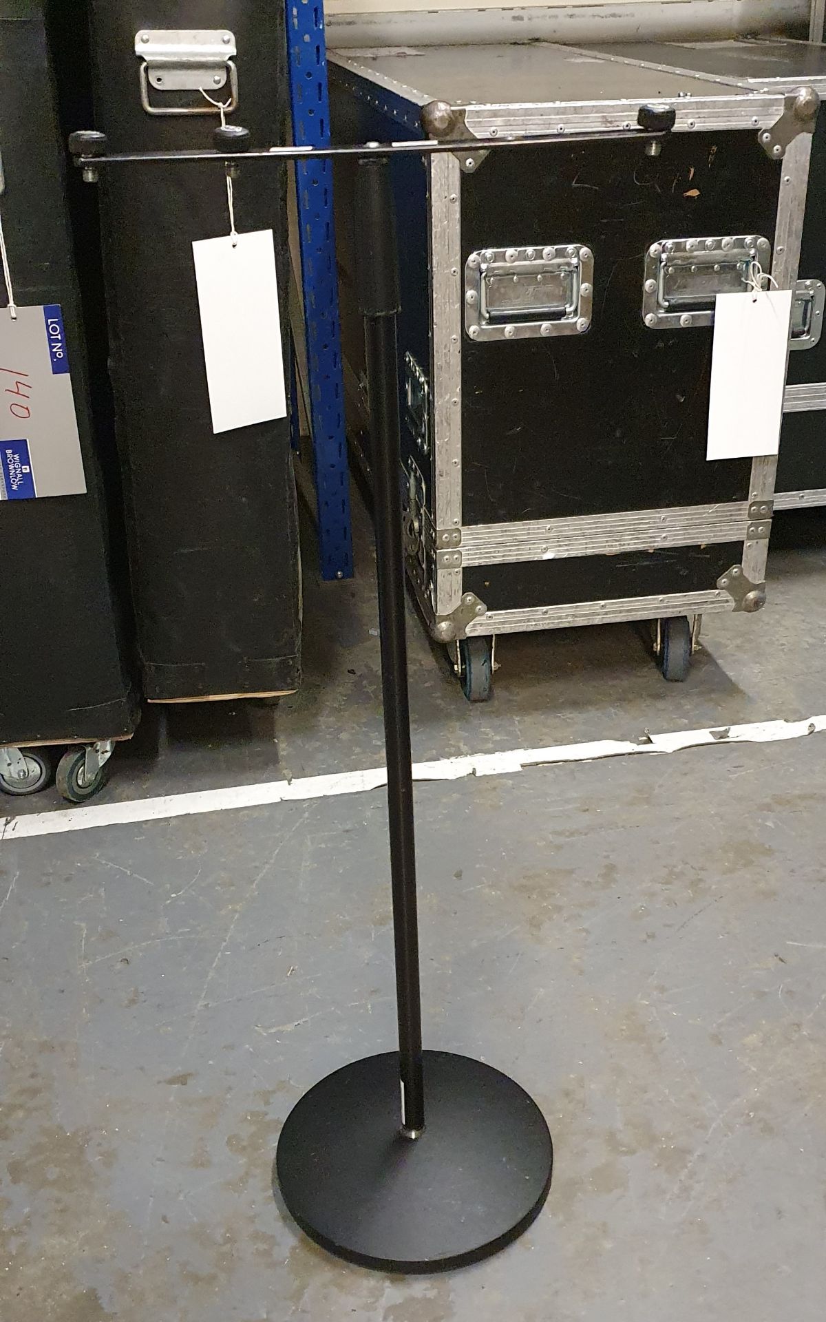 A Black Microphone Stand comprising: base, pole, t-bar with carry bag.