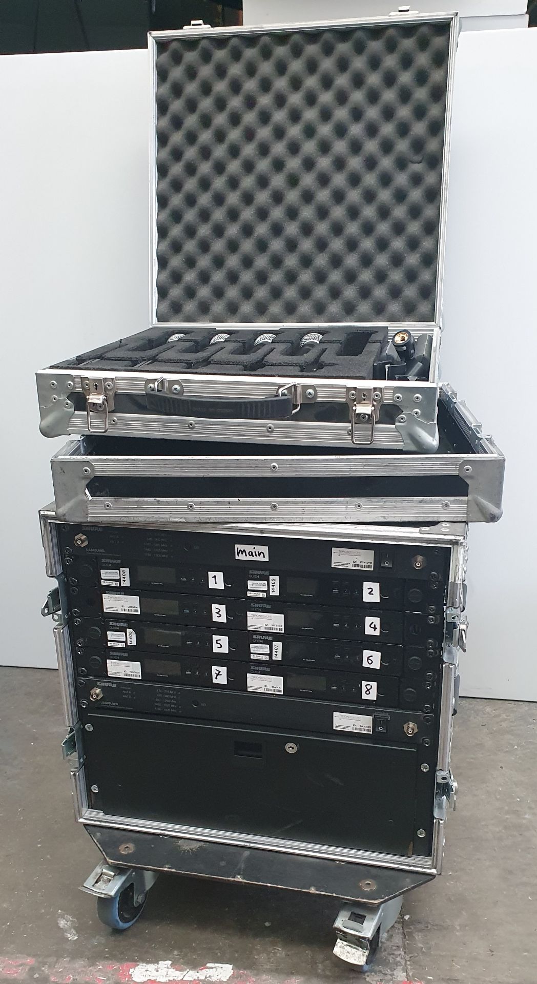 A Shure Microphone Kit comprising: 4 Shure QLXD1 Bodypack Transmitters with 4 Shure QLXD2/SM58
