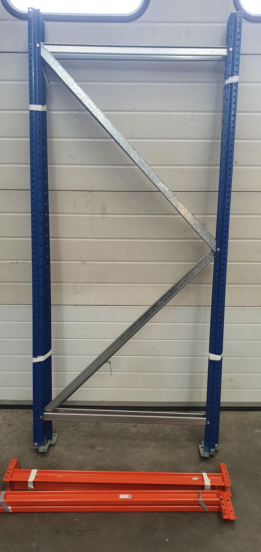 A Boltless Steel Rack with 2 Uprights, 6ft h, 4-1000mm Beams and 2 MDF Shelves (dismantled).