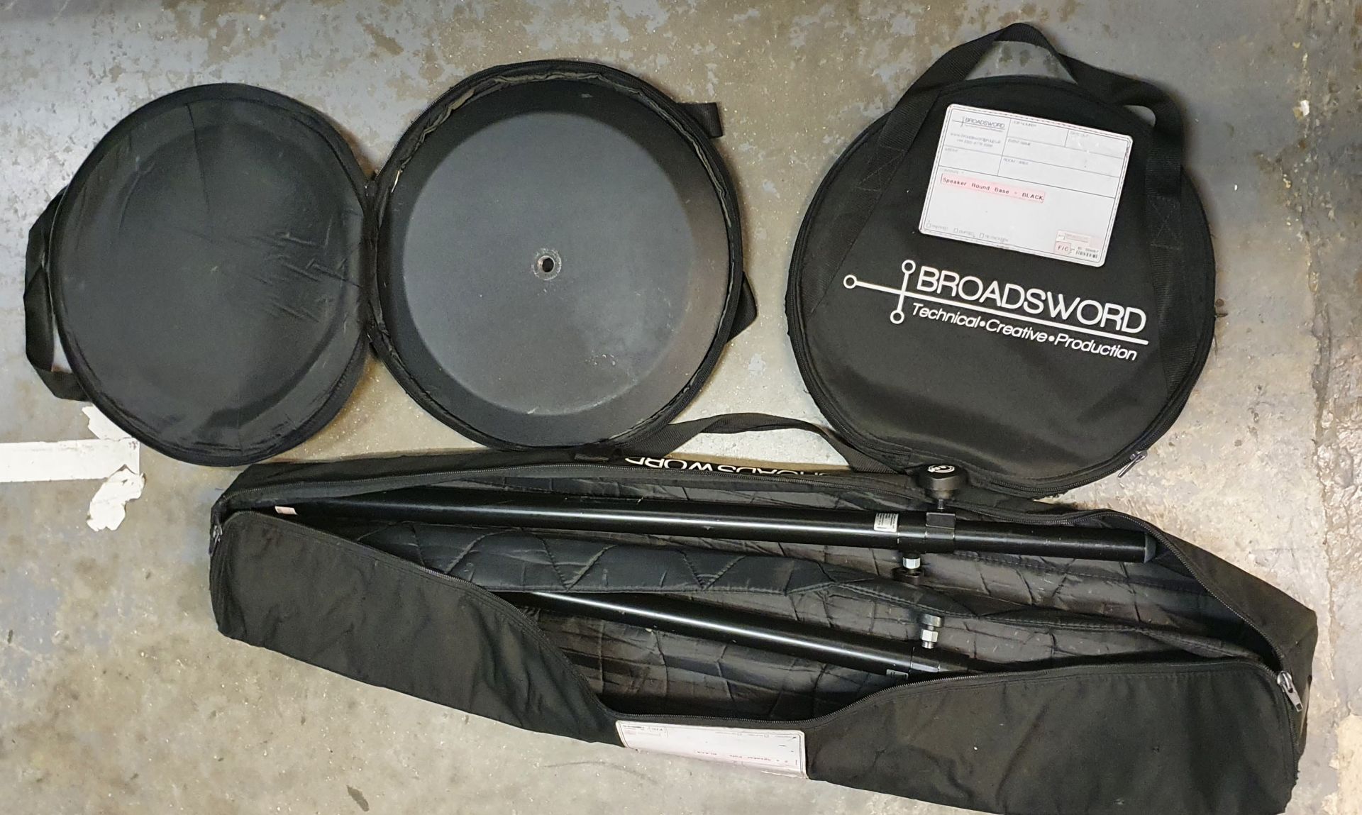 A Pair of K+M Black Speaker Round Base Stands comprising: 2 poles and 2 bases with carry bags. - Image 2 of 2
