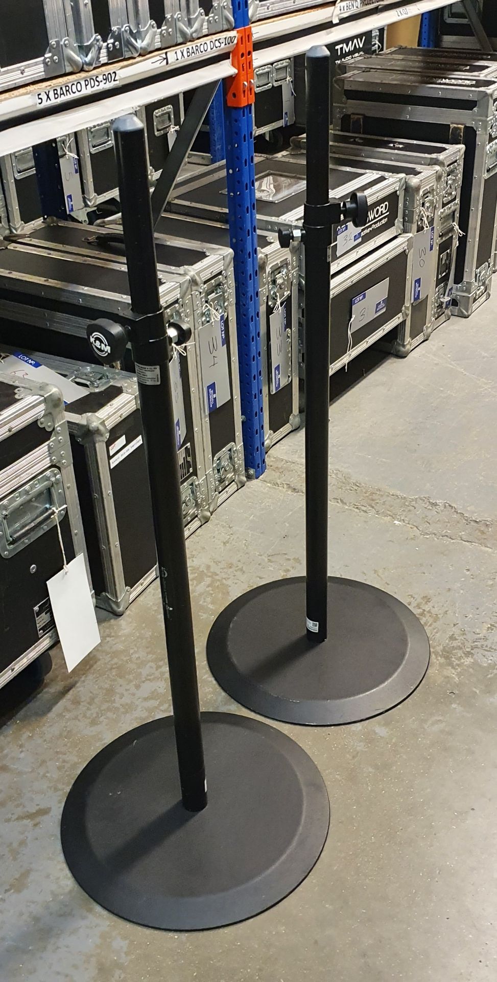 A Pair of K+M Black Speaker Round Base Stands comprising: 2 poles and 2 bases with carry bags.