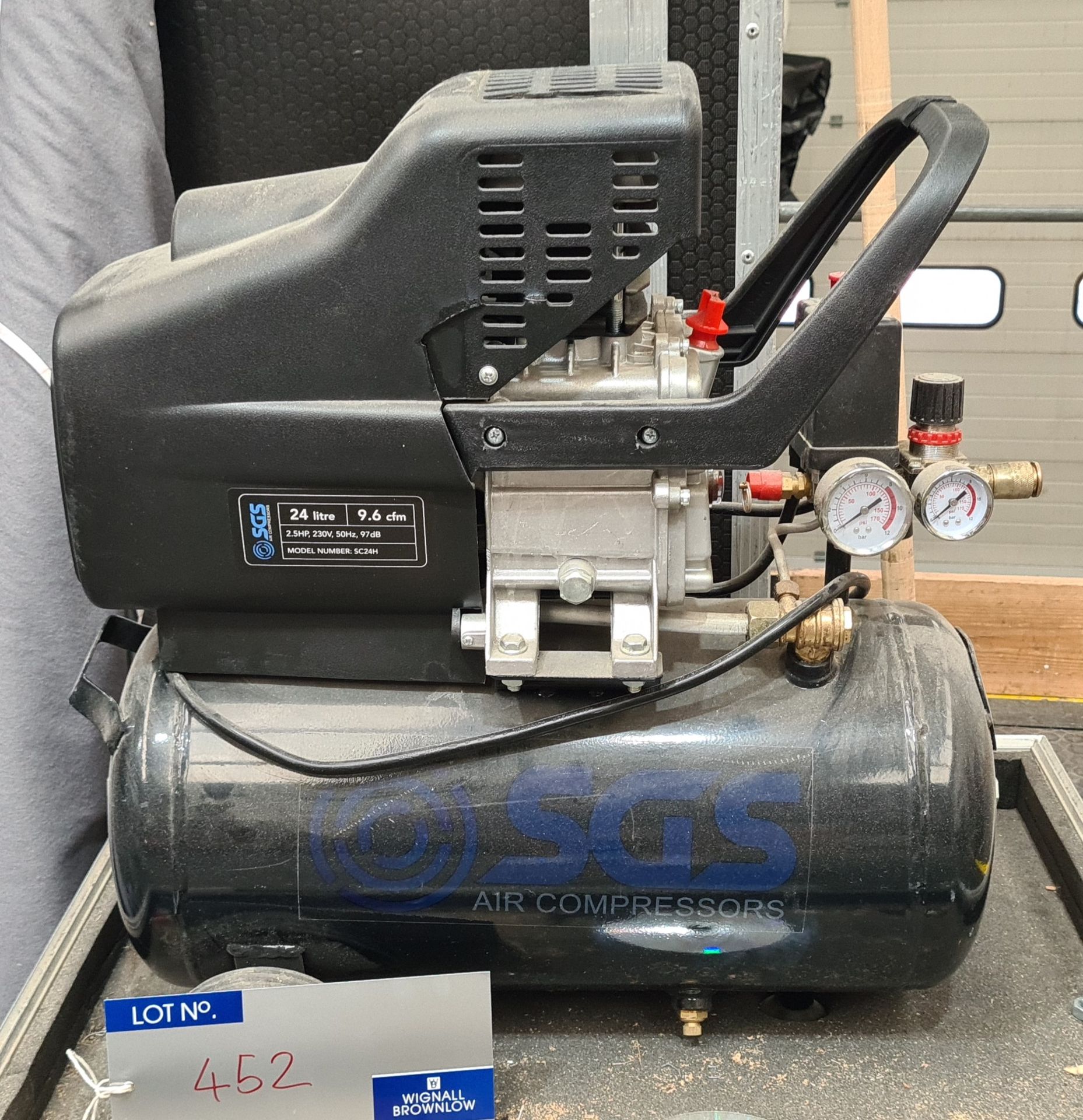 An SGS 24 Litre Direct Drive Portable Air Compressor (damage to plastic handle and body).