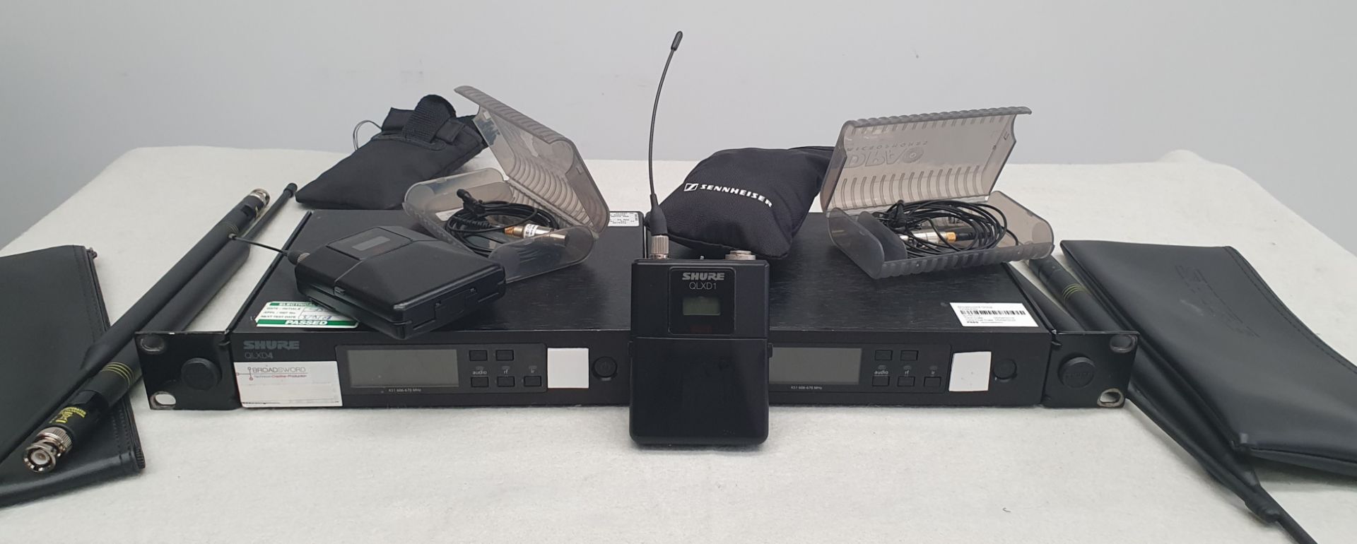 2 Shure QLXD4 Receivers, 2 Shure QLXD1 Bodypack Transmitters, 2 DPA 4060 Lapel Microphones and 2
