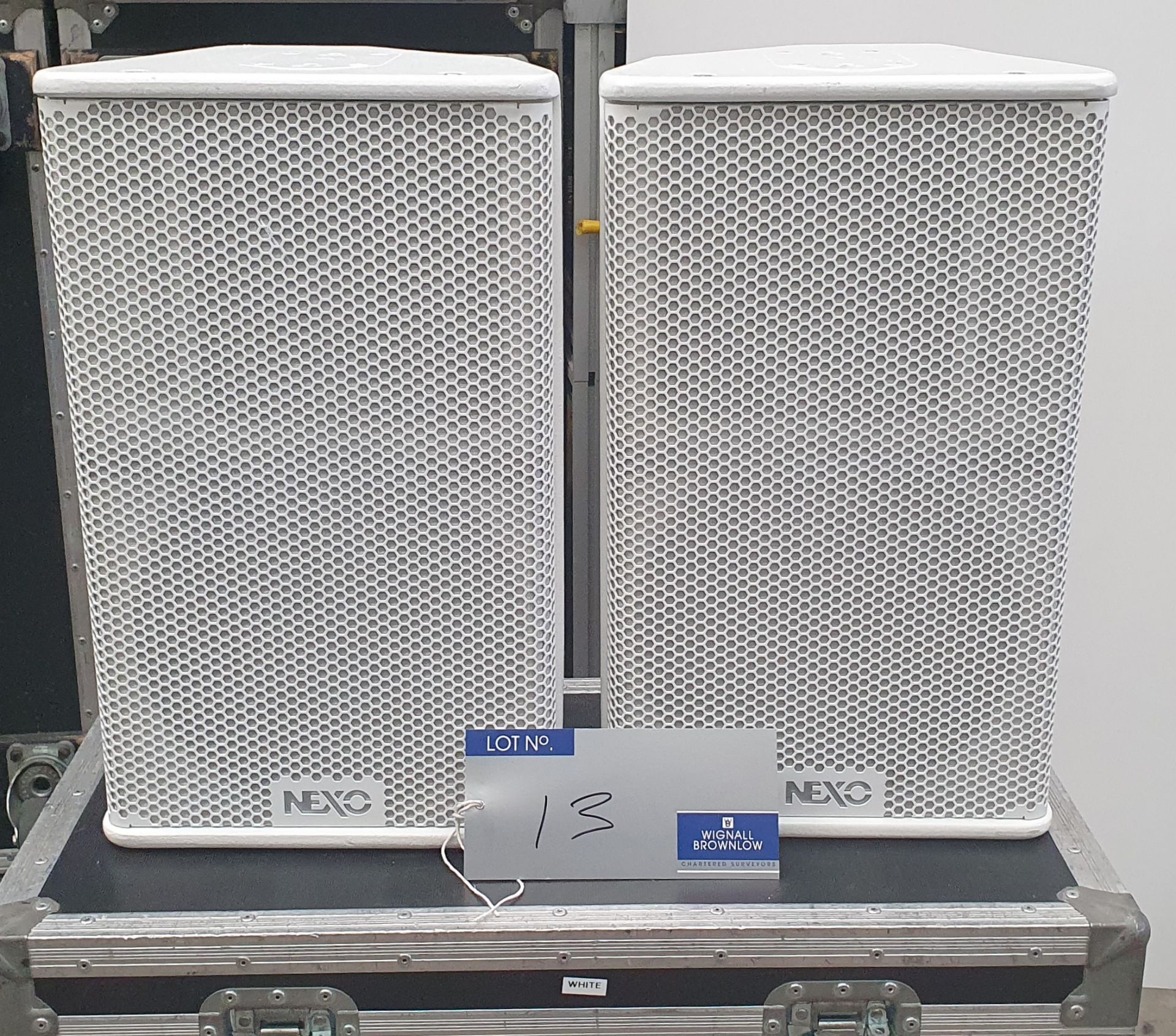 A Pair of White Nexo PS10 Full Range Loudspeakers with mobile flight case.