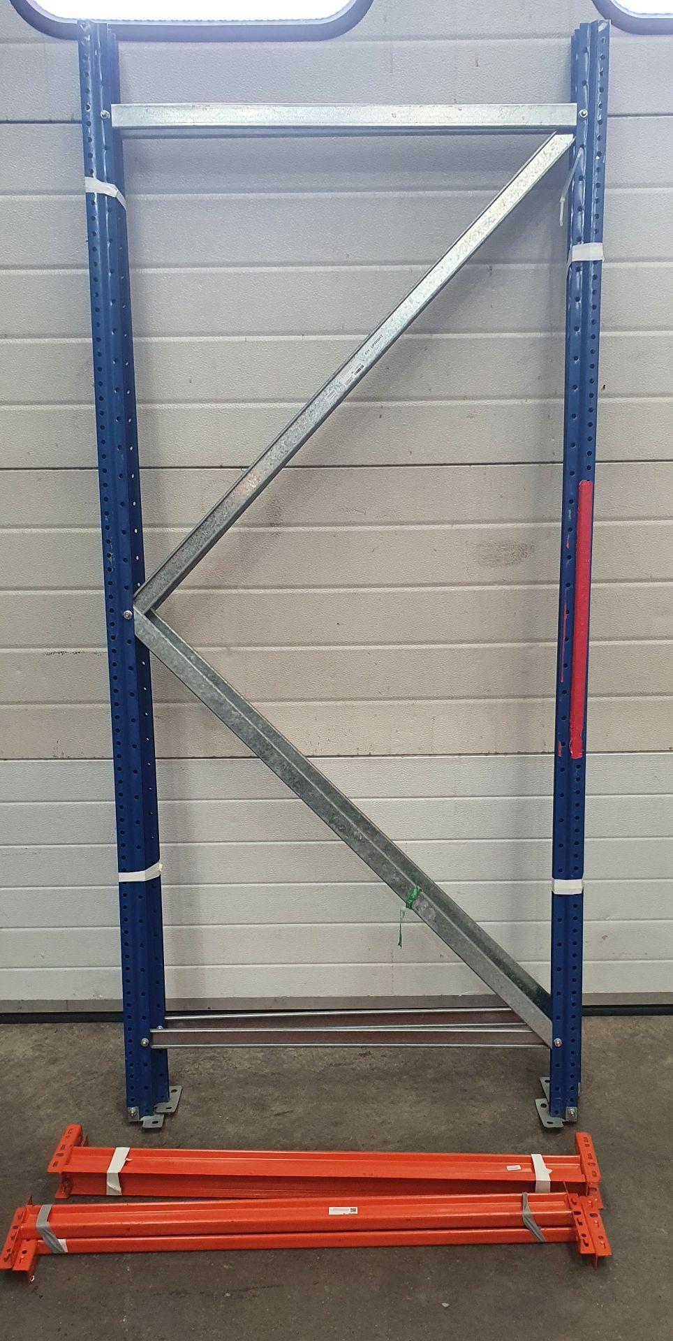 A Boltless Steel Rack with 2 Uprights, 6ft h, 4-1000mm Beams and 2 MDF Shelves (dismantled).