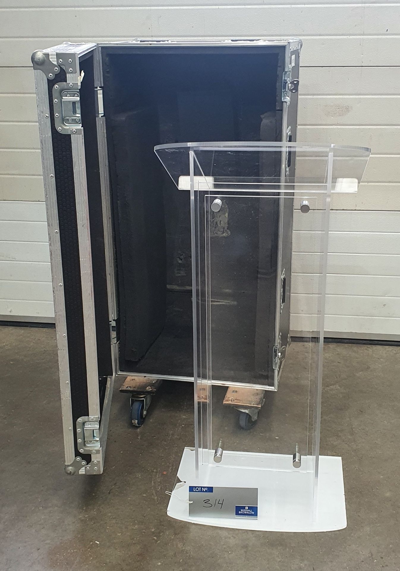 A Perspex Lectern with mobile flight case, 550mm x 650mm x 1240mm.