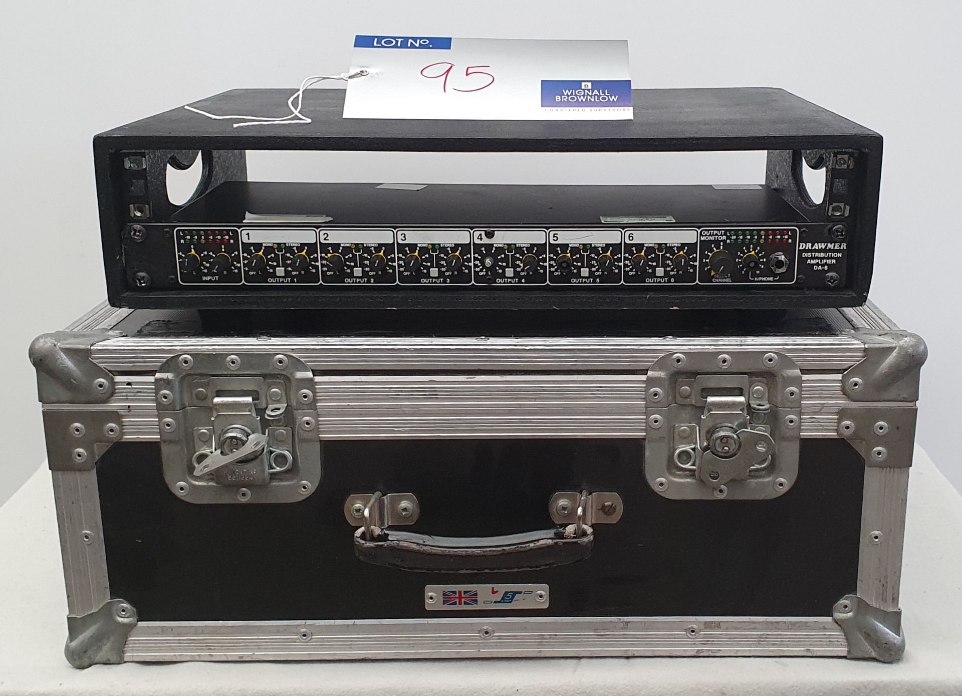 A Drawmer DA-6 Press Feed Distribution Amplifier No.6899 with flight case, 455mm x 580mm x 230mm.