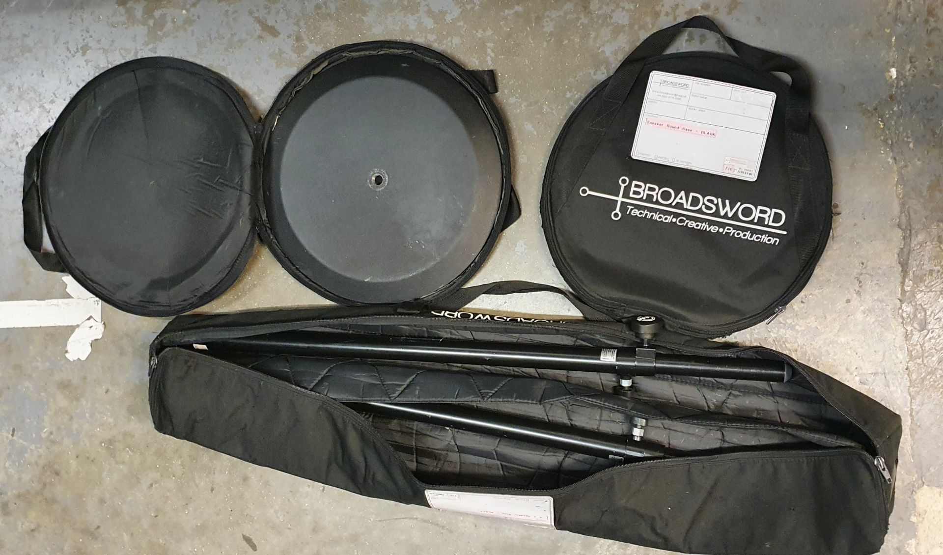 A Pair of K+M Black Speaker Round Base Stands comprising: 2 poles and 2 bases with carry bags. - Image 2 of 2