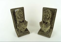 Pair of cast stone bookends