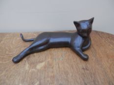 Very unsual lounging bronze cat with a resin finish