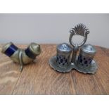One brass and one pewter salt and pepper set with blue glass liners