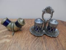 One brass and one pewter salt and pepper set with blue glass liners