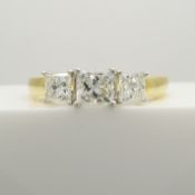 1.00 carat princess-cut diamond trilogy ring in 18ct yellow and white gold.