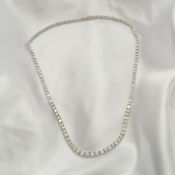 Stunning 18ct white gold graduated diamond "Riviere" necklace, boxed. Diamonds: 18.05 carats.
