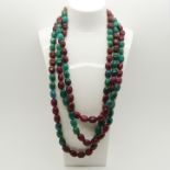 Unusual 945.00 carat earth-mined ruby and emerald oval bead necklace.