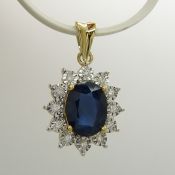 Sapphire and diamond cluster pendant in 9ct yellow gold.