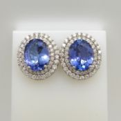 18ct white gold tanzanite and double diamond halo ear studs with screw backs, boxed.