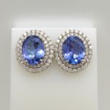 18ct white gold tanzanite and double diamond halo ear studs with screw backs, boxed.