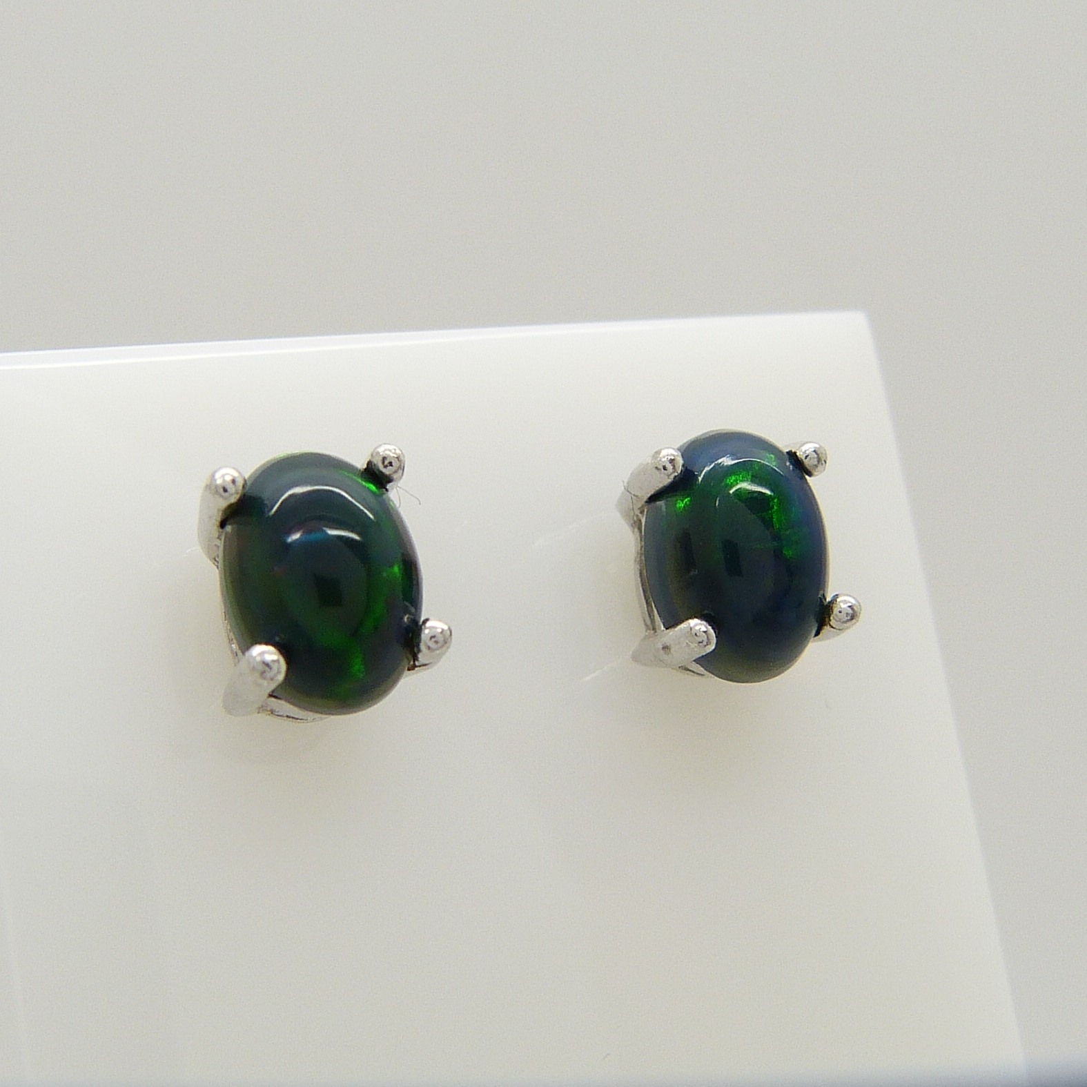 A pair of silver ear studs set with cabochon black Ethiopian opals, 1.10 carats (approx) - Image 2 of 5