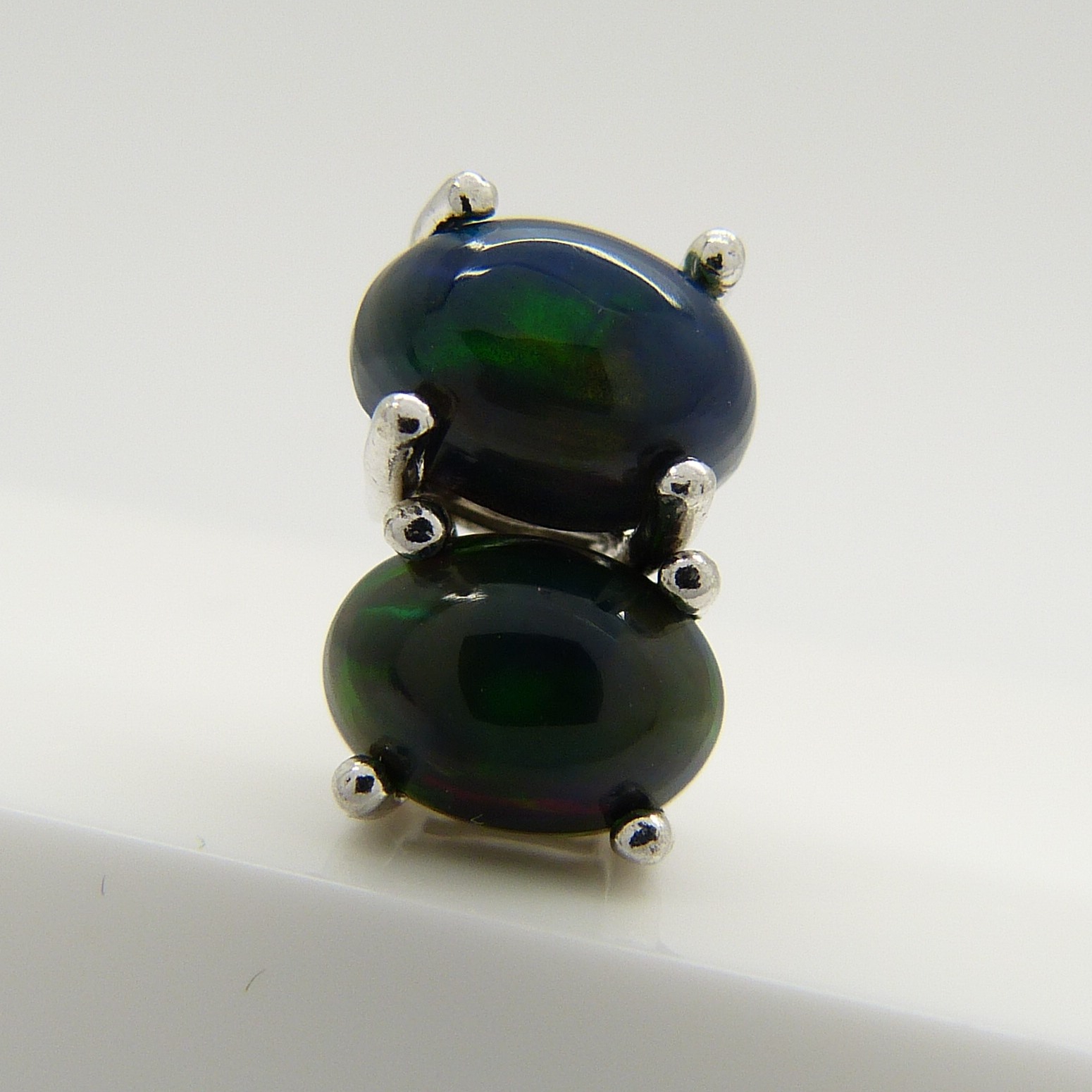 A pair of silver ear studs set with cabochon black Ethiopian opals, 1.10 carats (approx) - Image 3 of 5